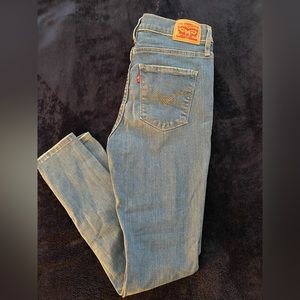 LEVI’S SIZE 28 FRINGED BLUE JEANS